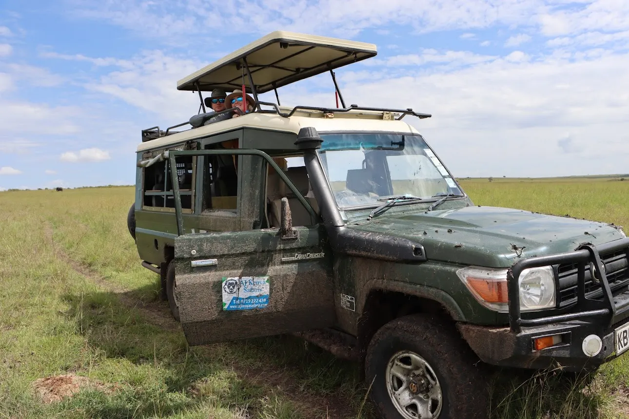 Our guests during game drives in Tanzania Serengeti during the calving season. 4x4 Safari land cruiser jeep.